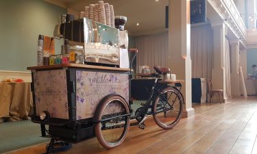 A coffee bike on a sunny day at an exhibition